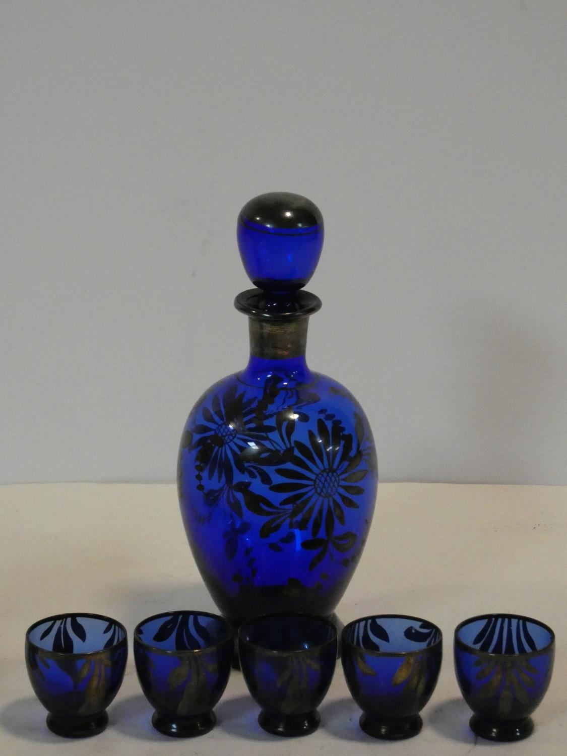 A cobalt blue glass decanter and shot glasses with painted silver floral design along with a - Image 2 of 3