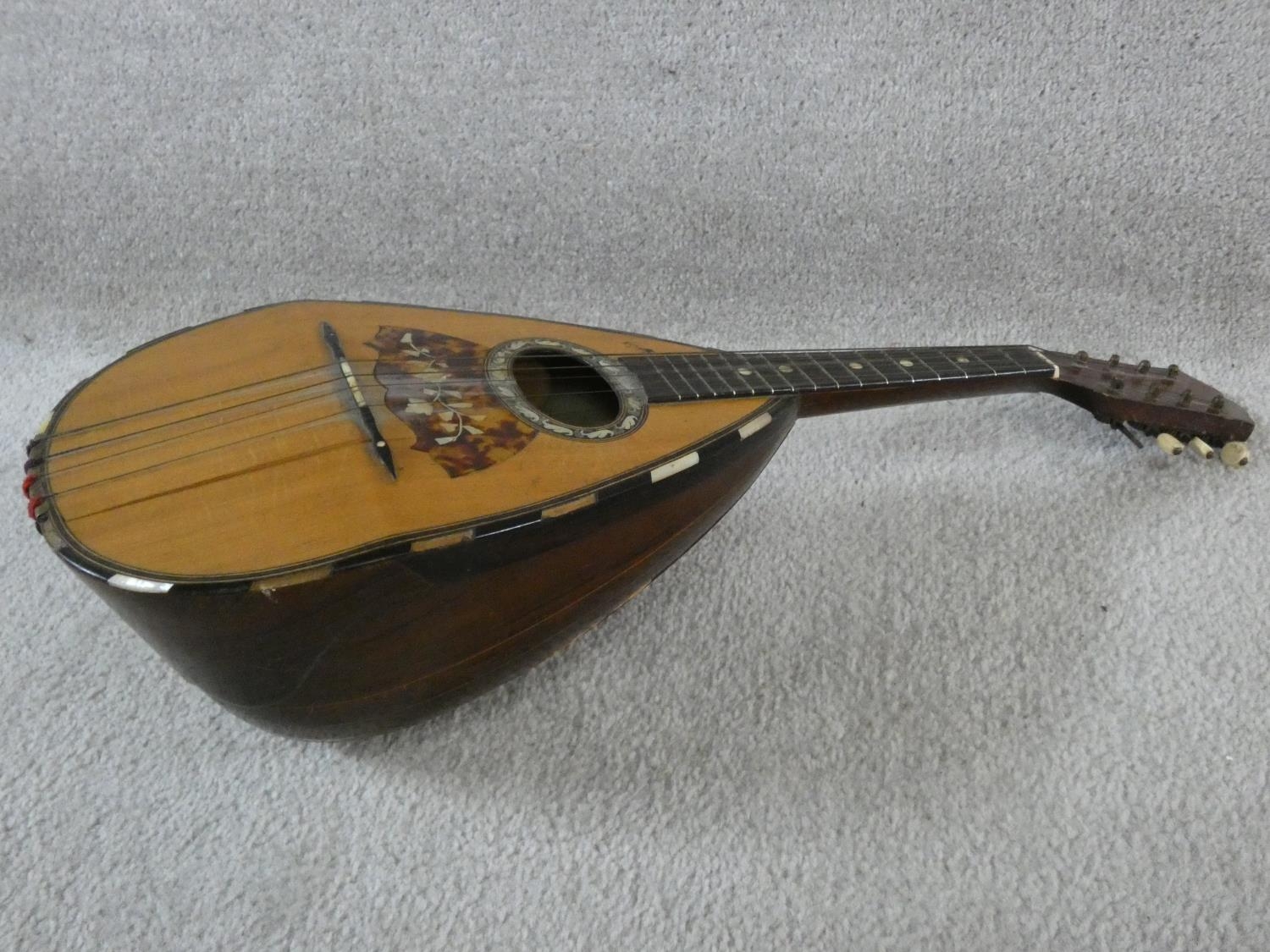 An early 20th century mandolin with mother of pearl and tortoiseshell inlay, signed Ozelli and - Image 8 of 13