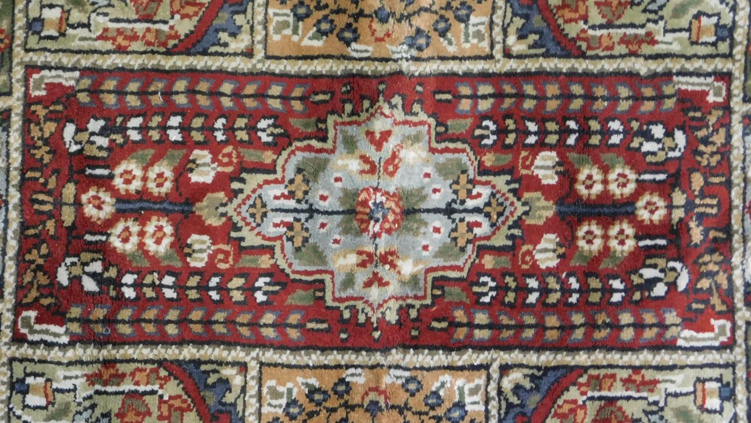 A Bachtiar rug with central pole medallion on burgundy ground within floral panels. 62x112cm - Image 2 of 4