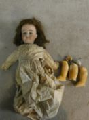 An antique German Armand Marseille bisque head girl doll, marked Made in Germany and with serial