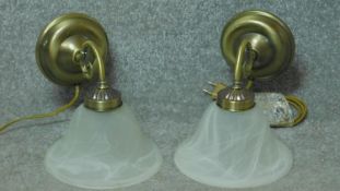 Two vintage style brass wall lights with marbled white glass shades. 20x25cm