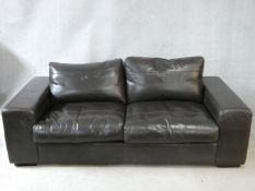 A vintage style brown leather down filled Collins & Hayes upholstered two seater sofa. H.70 W.202