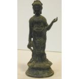 An antique bronze Buddha on lotus flower design base. Garbed in robes. H.22cm