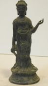 An antique bronze Buddha on lotus flower design base. Garbed in robes. H.22cm