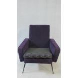 A 1960's vintage salon armchair in piped purple velour and cube design back and squab seat raised on