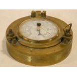 A small Italian ship's barometer in brass case. 11x11cm