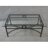 A metal framed conservatory low table with plate glass top. H.41xW.100xL.60cm