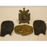 A 19th century brass framed oil on ceramic panel of the Madonna and Child and two bronze stylised