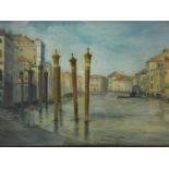 A large gilt framed and glazed watercolour, Venetian canal scene with figure seated on a quay,