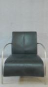 A vintage style leather armchair in black leather upholstery on metal tubular frame. 71cm