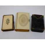 A 19th century leather bound bible with ivory cover and monogram, a similar in a faux ivory cover