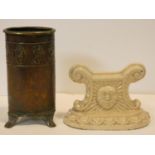 An Arts and Crafts brass cannister with incised decoration on three scrolling reeded feet and a