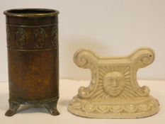 An Arts and Crafts brass cannister with incised decoration on three scrolling reeded feet and a