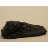 A patinated brass sculpture of a dogs head, possibly while swimming. Signed PB. H.5 W.18 D.15cm