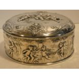 A Continental white metal hinged lidded caddy with gilded interior decorated with repousse repeating