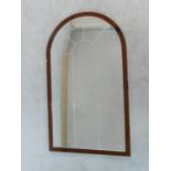 An arched pier mirror in bronzed glazed frame. 122x72cm