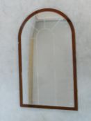 An arched pier mirror in bronzed glazed frame. 122x72cm