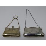 A silver and silver plated finger held ladies coin purse. The silver plated purse has a repousse