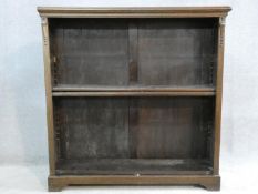 A mid century vintage oak open bookcase on bracket feet. H.107 W.106 D.29cm