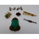 A collection of jewellery. Including an Art Deco jade glass and brass fruit design pendant, a pair