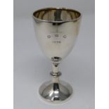 An English silver trophy cup hallmarked Birmingham, engraved D.G.C. 1938. H.13cm