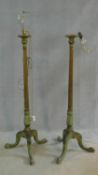 A pair of mid century carved giltwood standard lamps with fluted columns on tripod cabriole supports