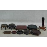 A miscellaneous collection of ten Chinese carved and pierced hardwood urn and plate stands. H.