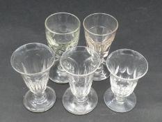 A collection of five 19th and 18th century glasses. Including a petal cut toast master's glass,