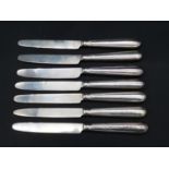 A set of seven antique silver fruit knives, handles and blades hallmarked, four marked Samuel Hennel