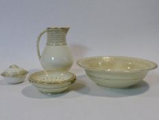 An early 19th century Wedgwood bathroom set in an ivory blush palette ceramic to include water