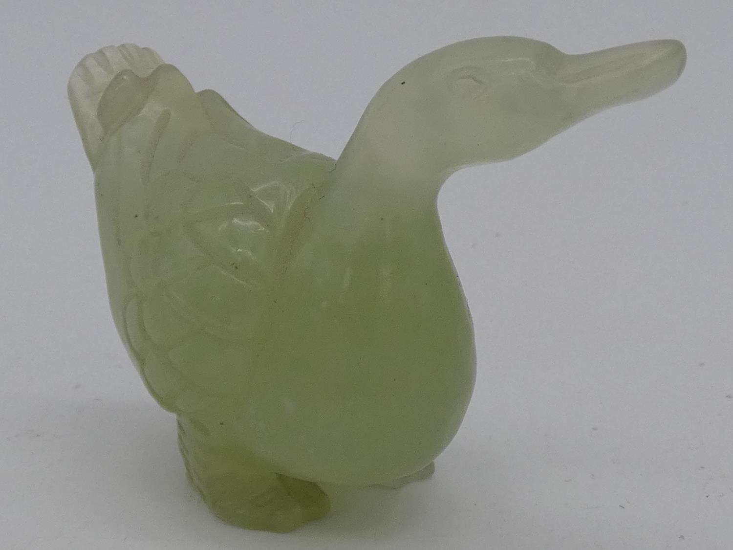 A miscellaneous collection of seven Chinese carvings in jade and coral, including figures, - Image 10 of 15