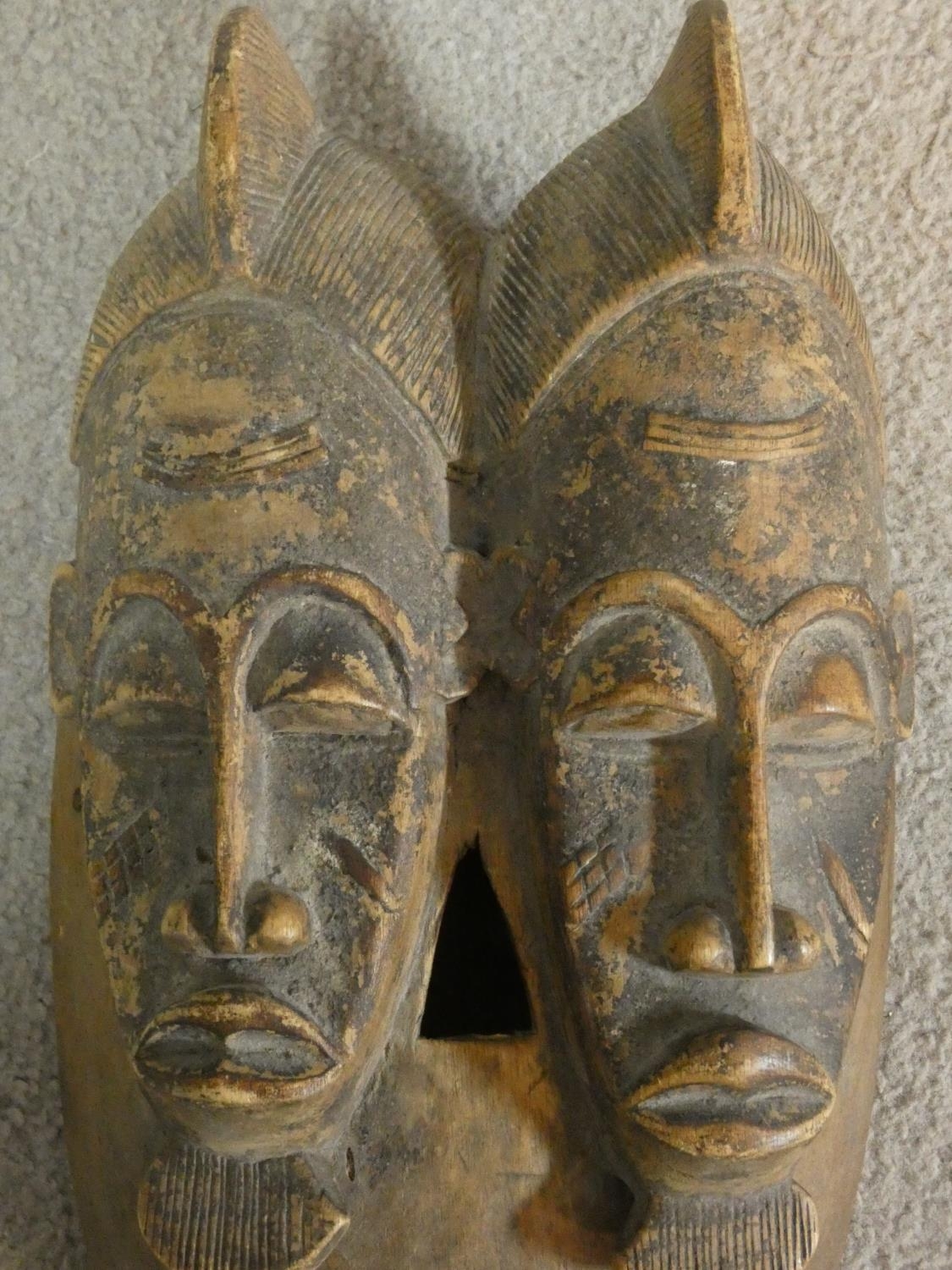 A carved hardwood Baule 'Twin Face Mask' from the Ivory Coast 37x20cm - Image 2 of 5