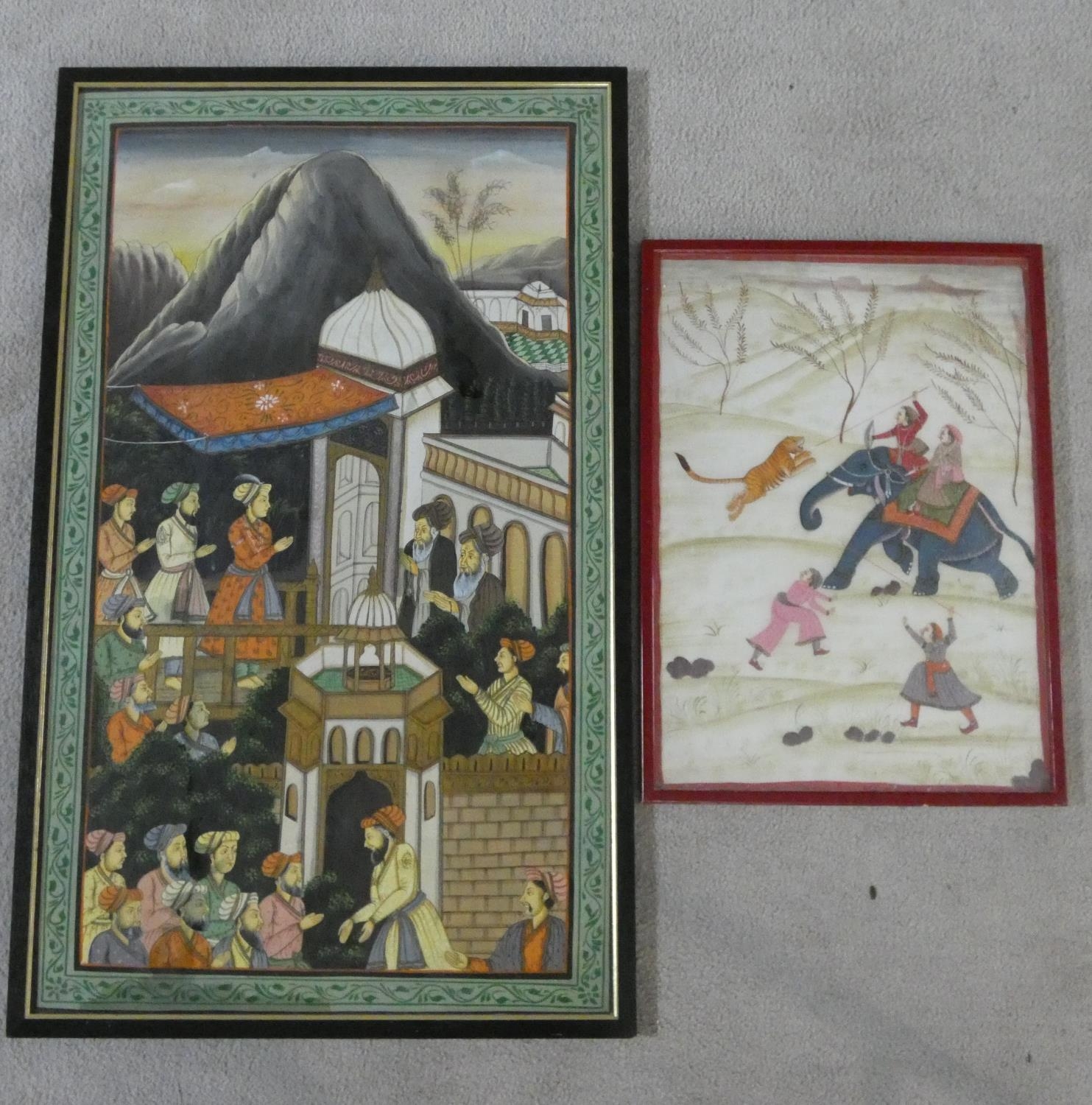 Two framed and glazed Indo-Persian silk paintings. One of a hunt on elephant back with wild