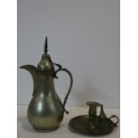 A Eastern brass coffee pot and a 19th century chamberstick and snuffer. H.31cm (tallest)