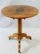 A 19th century Continental walnut tilt top occasional table with satinwood stringing and central
