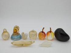 A collection of glass paperweights including Isle of Wight, Kosta Boda and a Haveland seal, a Murano