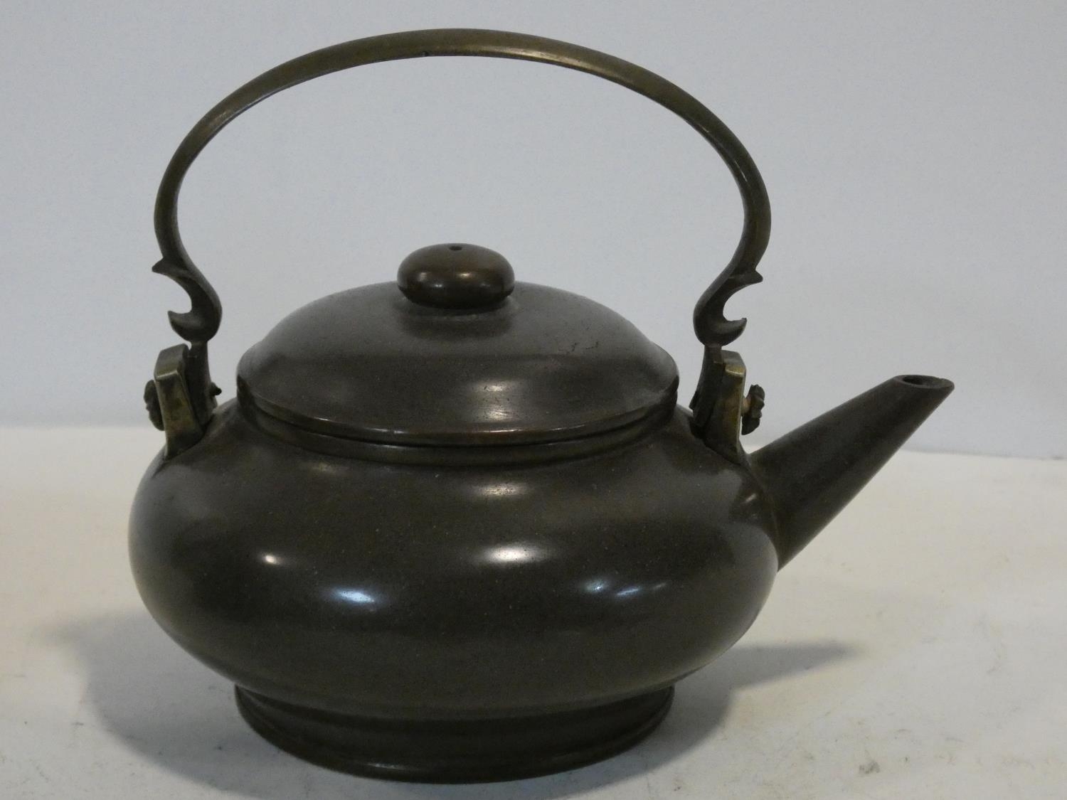 Two Chinese Yixing Pottery teapots with cast brass handles and finials and banding around the edges, - Image 6 of 11