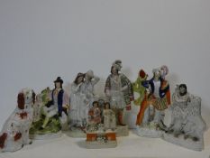 A miscellaneous collection of seven 19th century Staffordshire figure groups to include a Spaniel,