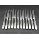 A set of twelve silver handled table knives by Robert Tricket, Moses Brent, John Carter II and
