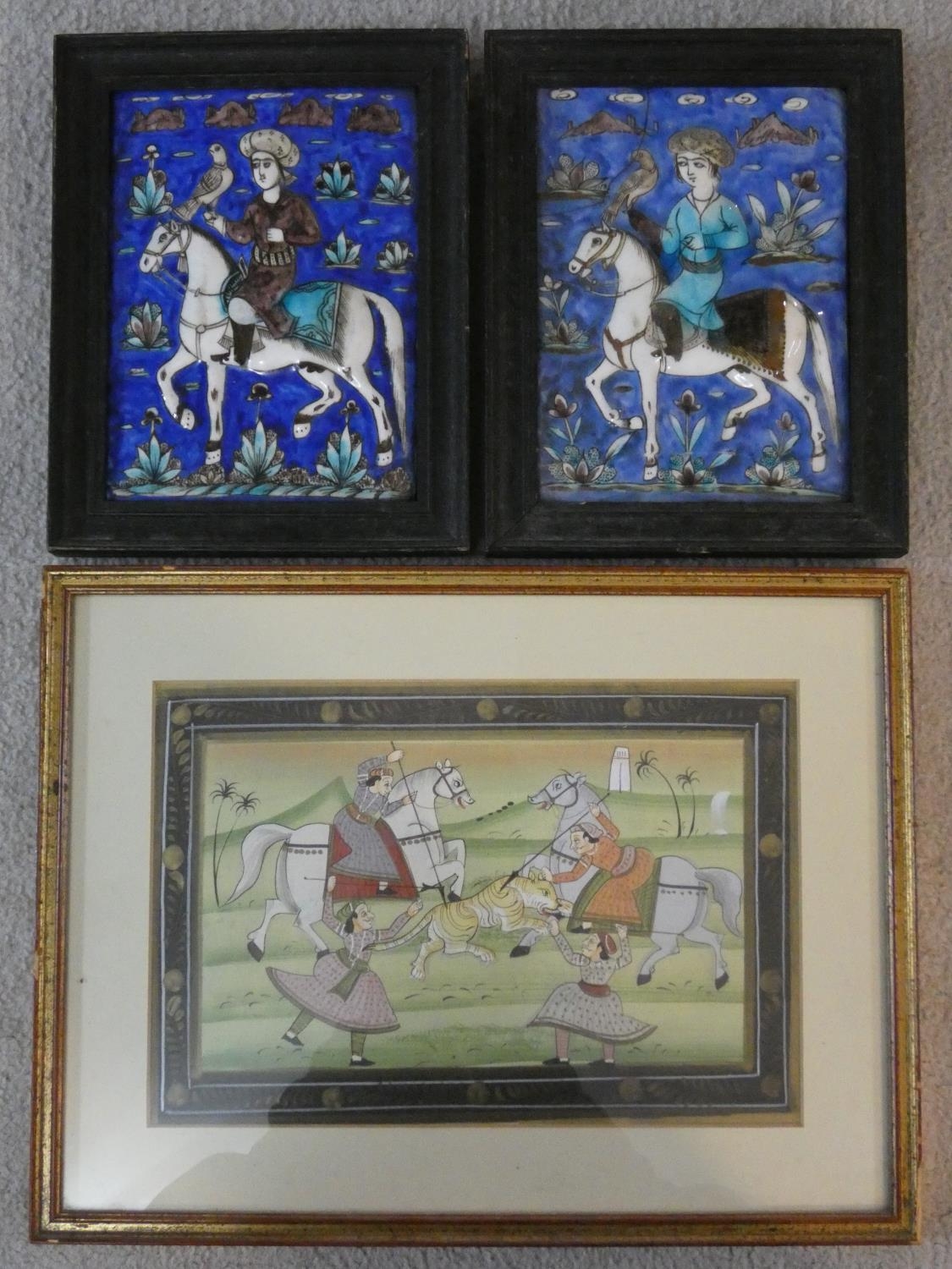 A pair of antique Qajar Persian hand painted and polychrome glazed ceramic tiles and a framed Indo