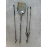 An early 19th century steel fire set; pair of tongs, shovel and poker. L.79cm