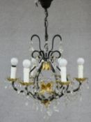 A metal and gilt six branch chandelier with crystal drops. H.74 W.55 D.55cm