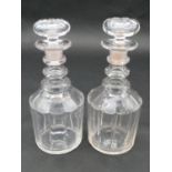 A pair of cut and facetted Georgian decanters of mallet form with three ring necks and original