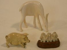 Three early 20th century carved ivory figures, the three wise monkeys, a sow and a grazing deer. H.