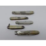 Four antique silver and mother of pearl fruit knives along with a vintage miniature celluloid pen