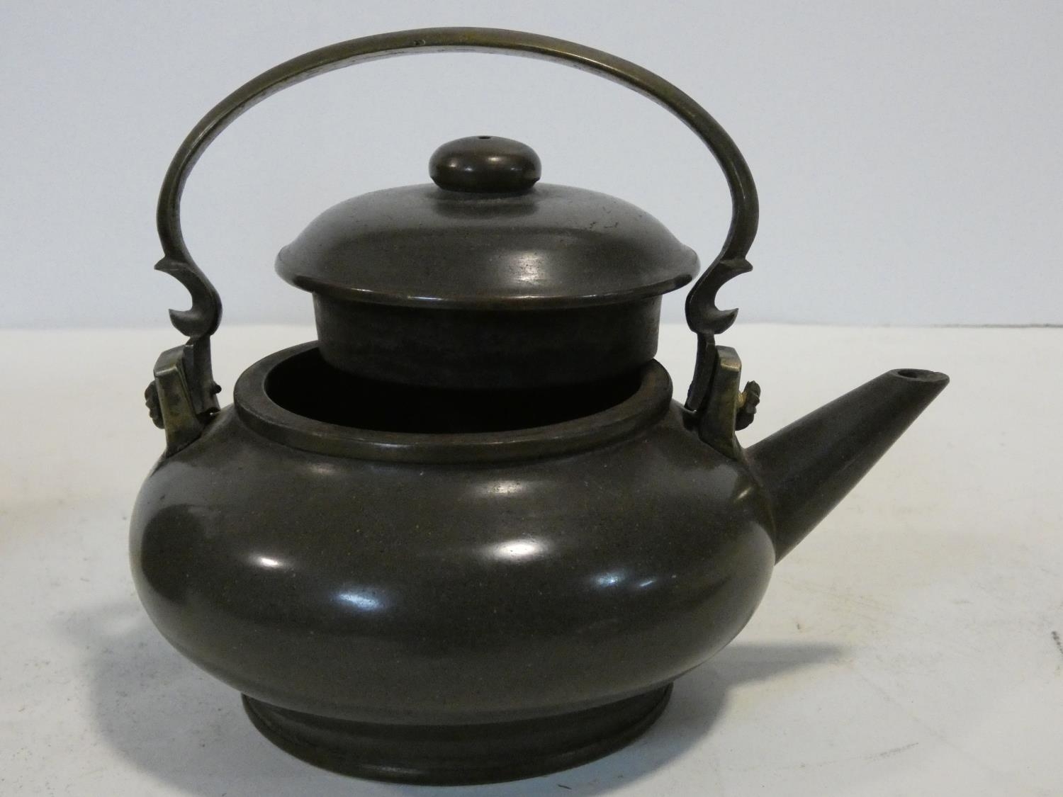 Two Chinese Yixing Pottery teapots with cast brass handles and finials and banding around the edges, - Image 7 of 11