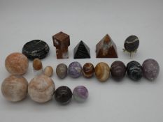 An extensive collection of carved marble and gemstone spheres, eggs and pyramids, etc H.8cm (