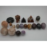An extensive collection of carved marble and gemstone spheres, eggs and pyramids, etc H.8cm (