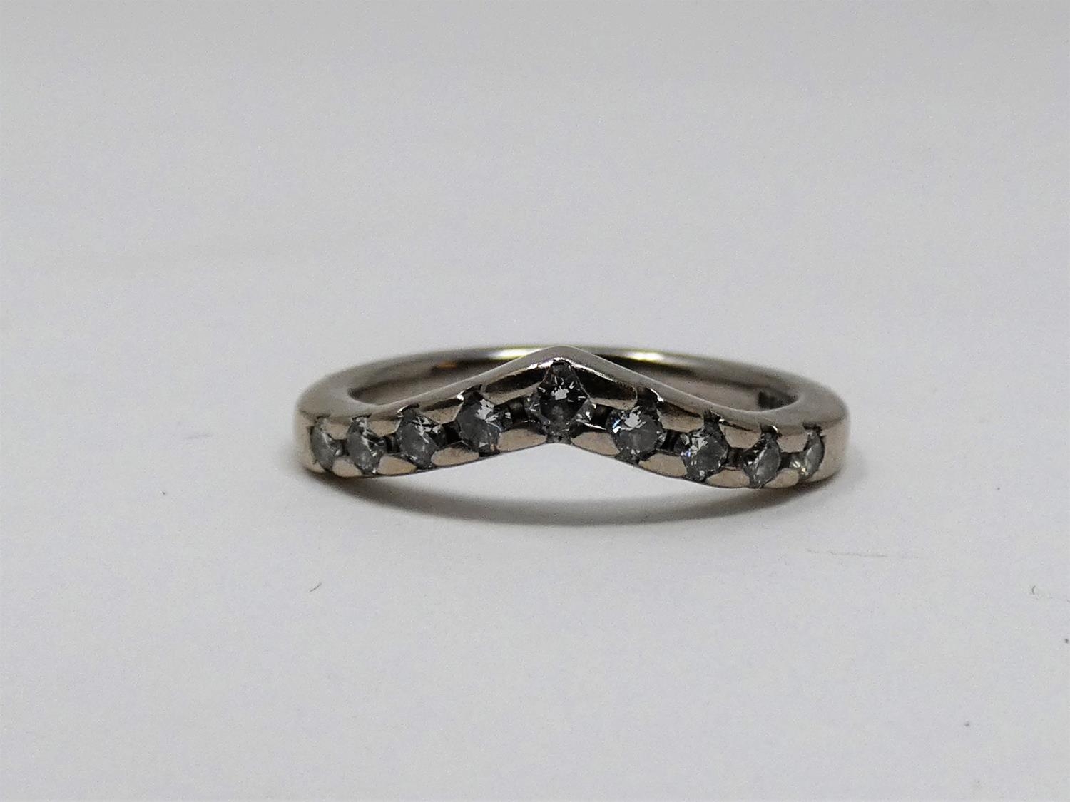 A vintage wishbone 18ct white gold and diamond half eternity ring. Set with nine round brilliant cut - Image 3 of 5