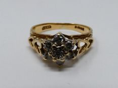 A vintage diamond and 9ct yellow gold floral cluster ring, set with seven round brilliant cut